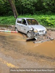 Tanah Datar, Indonesia - May 12, 2024: the condition of the car was badly damaged due to cold lava flash floods. Natural Disaster in Singgalang, Sepuluh Koto District, Tanah Datar, West Sumatra, Indonesia 426jny