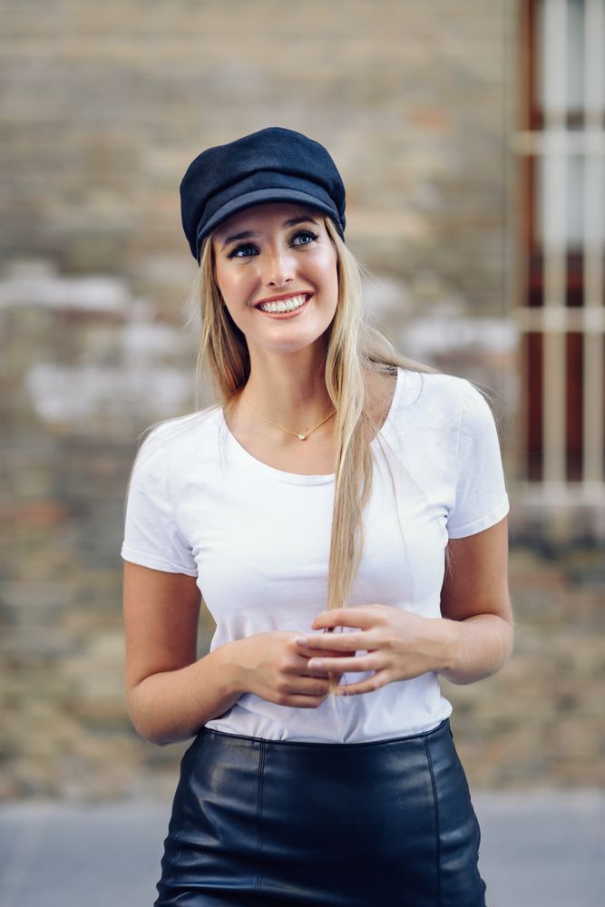 Smiling trendy woman walking outside