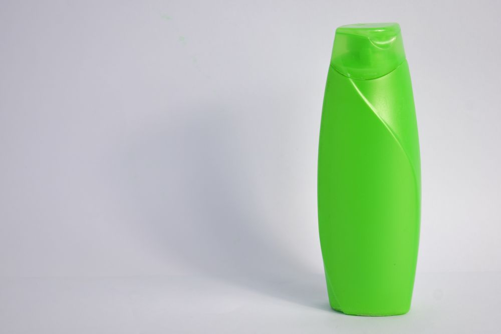 Green mockup body wash bottle with copy space