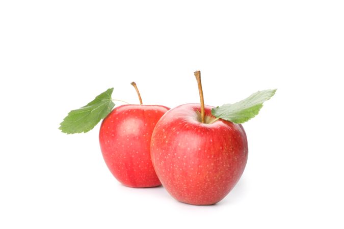 Sweet red apples isolated on light background