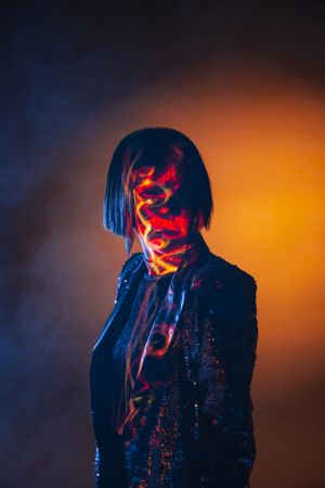 Stylish woman singing on stage