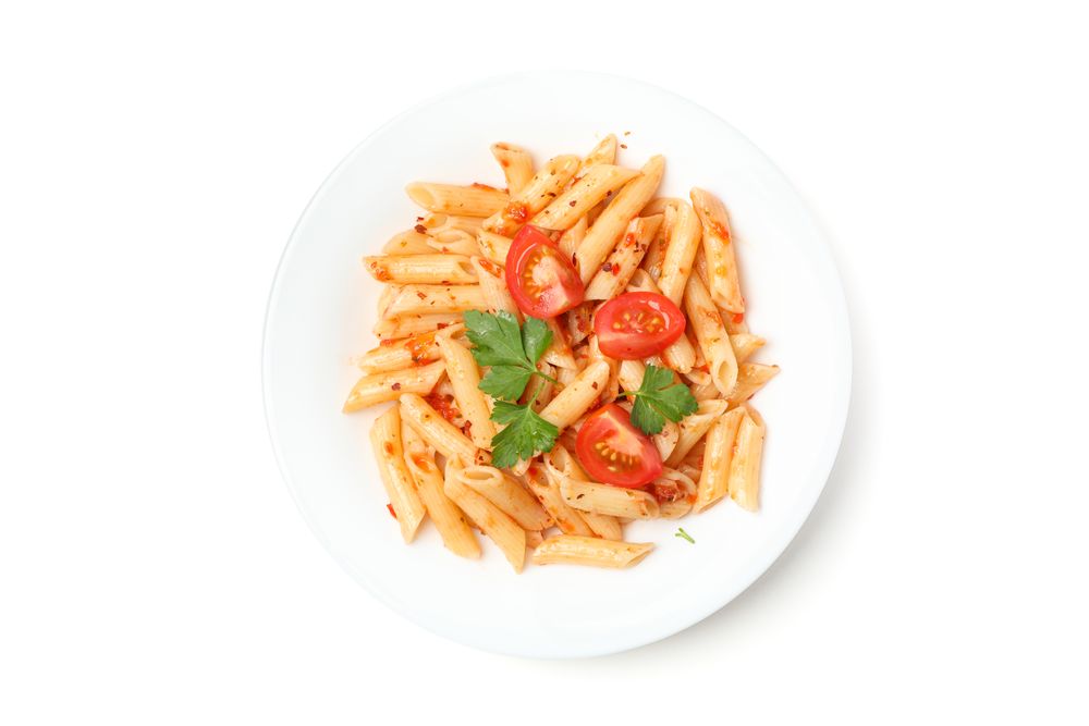 Plate with tasty pasta isolated on plain background