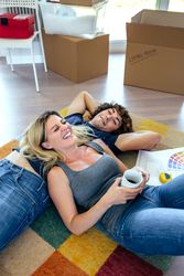 Couple resting lying on the carpet