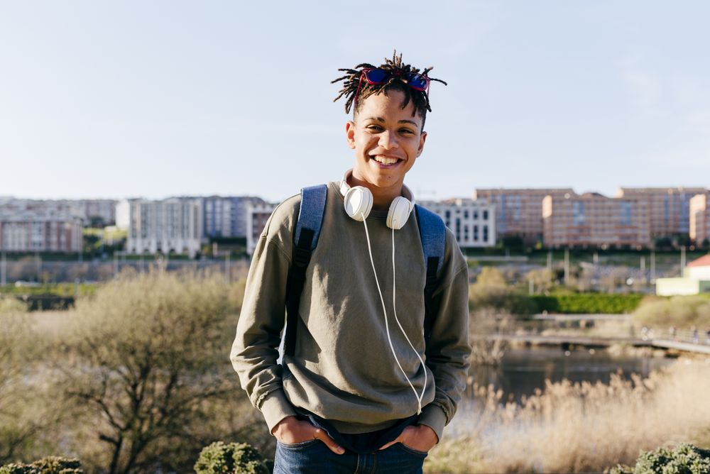 Young Black smiling male looking at camera