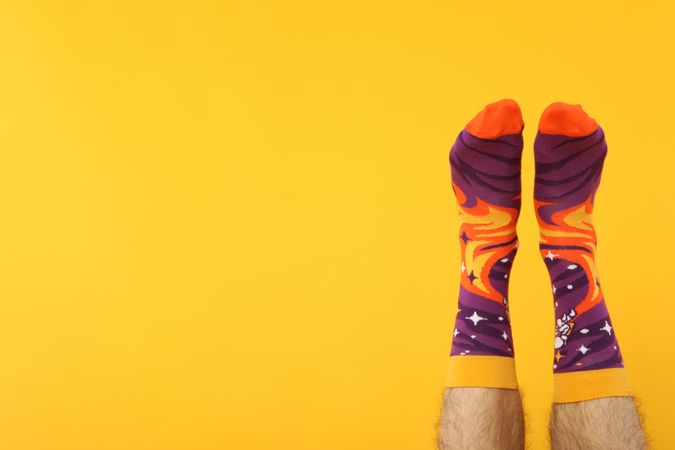 Casual clothes and wearing concept - socks, clothes for foot