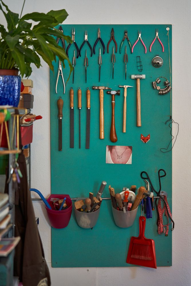 Set of various jewelry tools hanging on wall