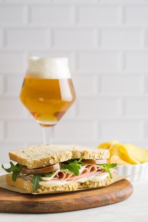 Delicious sandwich with ham, cheese, lettuce and tomato