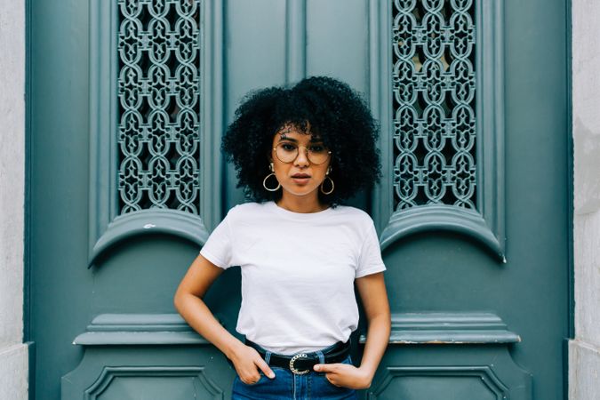 Stylish Black female by green door
