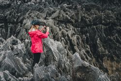 Female taking photos on cliffs