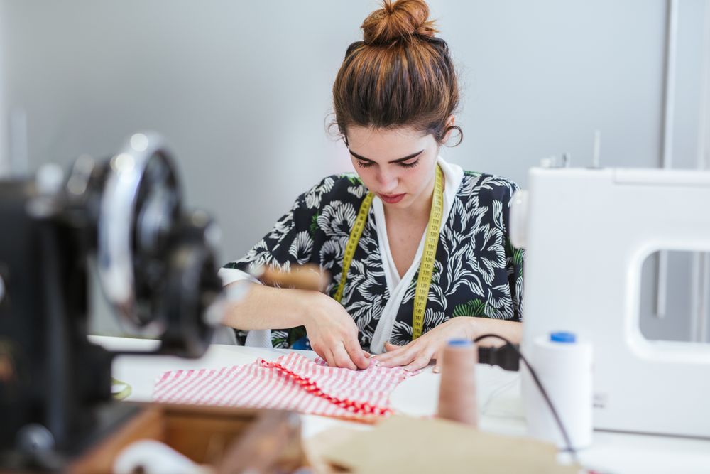 Woman in a sewing school