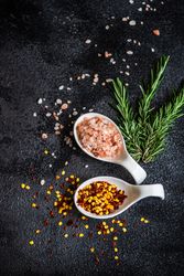 Cooking concept with rosemary, chilli flakes and salt