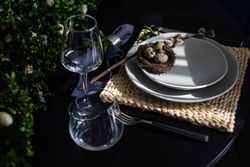 Easter table setting with elegant glassware and decorative nest