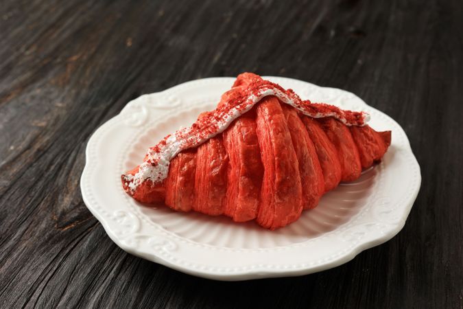 Red velvet French croissant with frosting