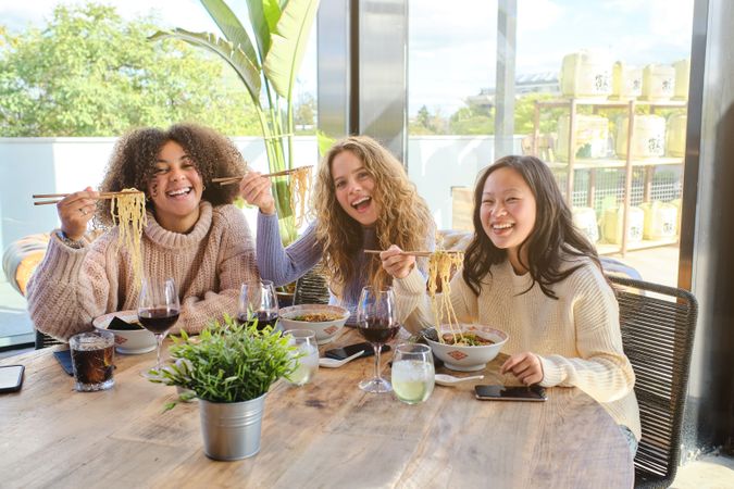 Cheerful women having lunch in restaurant