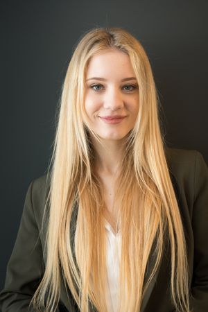 Gorgeous female portrait posing in business suit