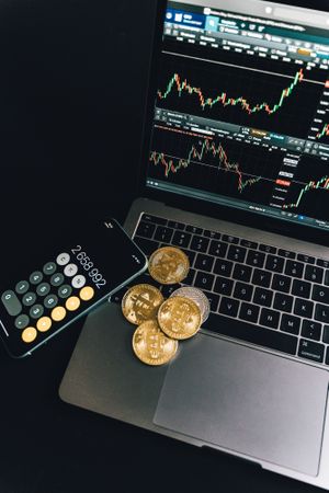 Top view of bitcoins on a laptop and smartphone