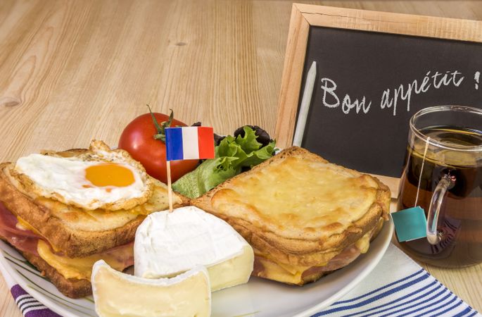 French dish with message on chalkboard
