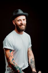 Smiling young guy in hat