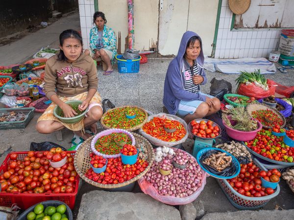 Sulawesi Island, Indonesia - August, 15 2015: Women selling vegetables on street