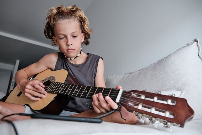 Child playing the guitar
