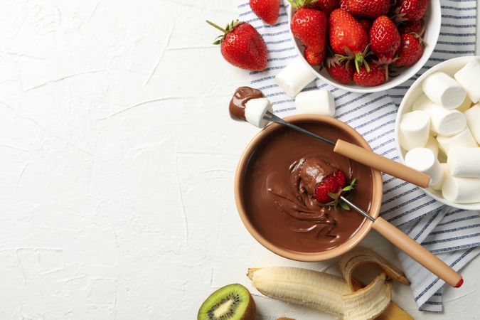 Composition with strawberry and marshmallow in chocolate, top view. Chocolate fondue