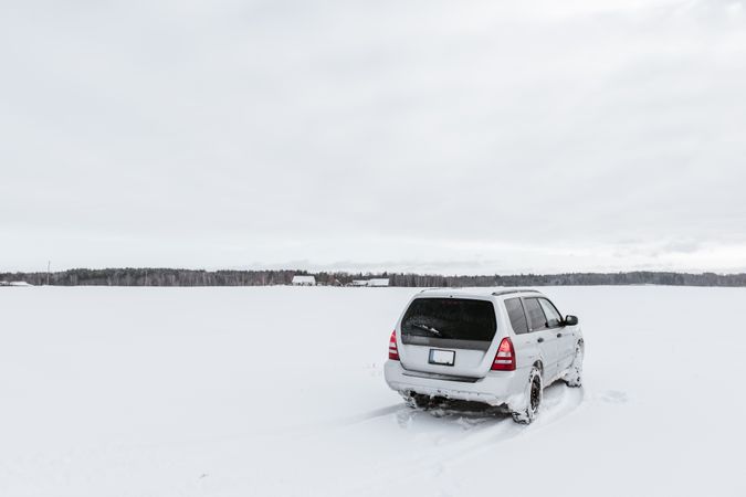 Car driving on snow field
