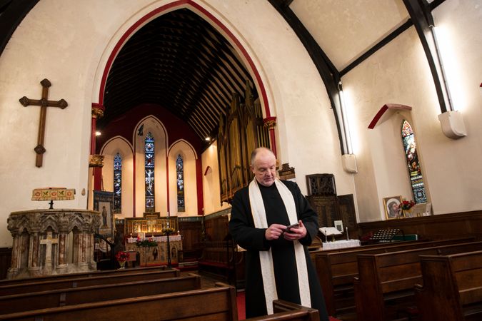 Vicar in church