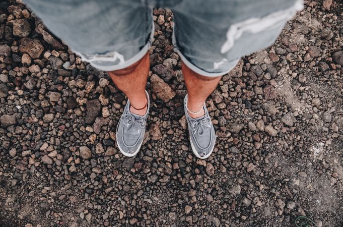 Crop legs on road from above