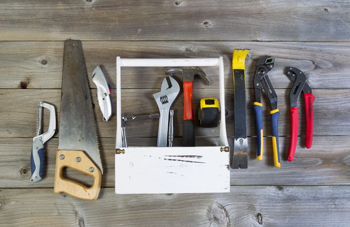 Work tools with holder on aged wood