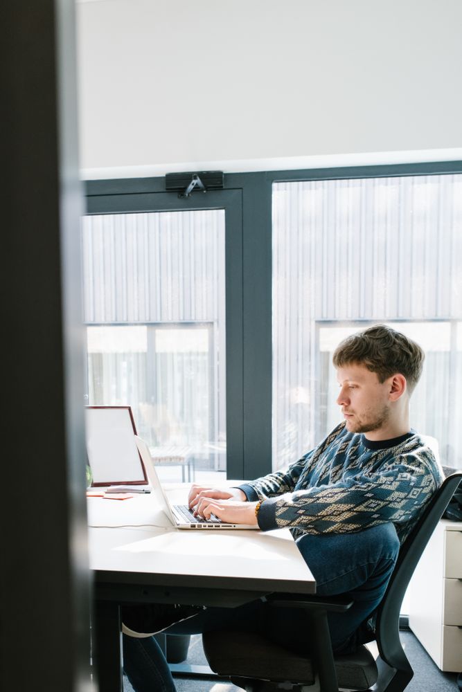 Man working on laptop in office