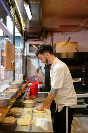 Pizza man making pizza shape