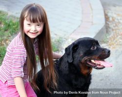 Smiling Girl With Down Syndrome And Her Dog - Free Photo (0WV3Pb