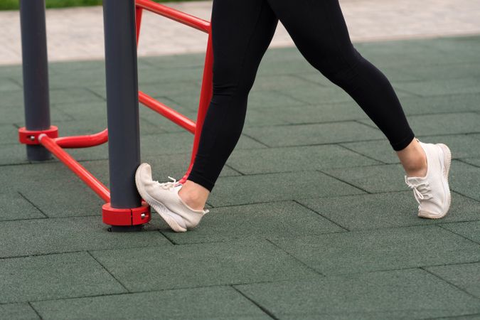 Close-up of woman's foot against outdoor equipment