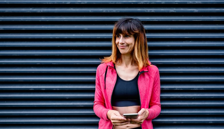 Female athlete with mobile phone