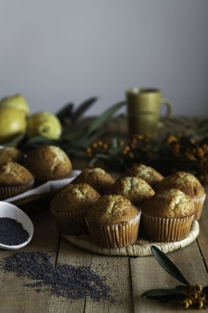 Fresh tasty muffins on table decorated with berries