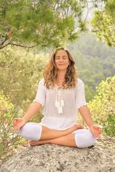 Woman meditating in summer nature