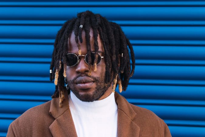 Black man in trendy sunglasses in city