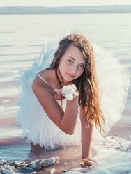 Teenage girl in fresh water in sunny day