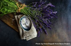 Fresh lavender flowers on a wooden kitchen board with salt 4OdYoo