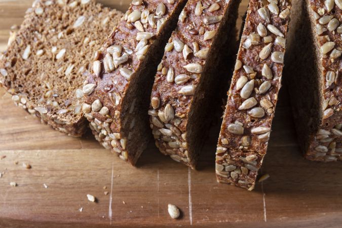 Sliced bread on wooden background