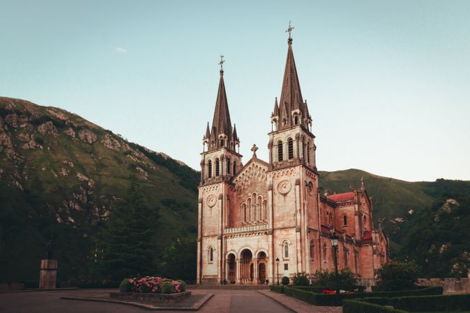 Old cathedral near hills and blue sky