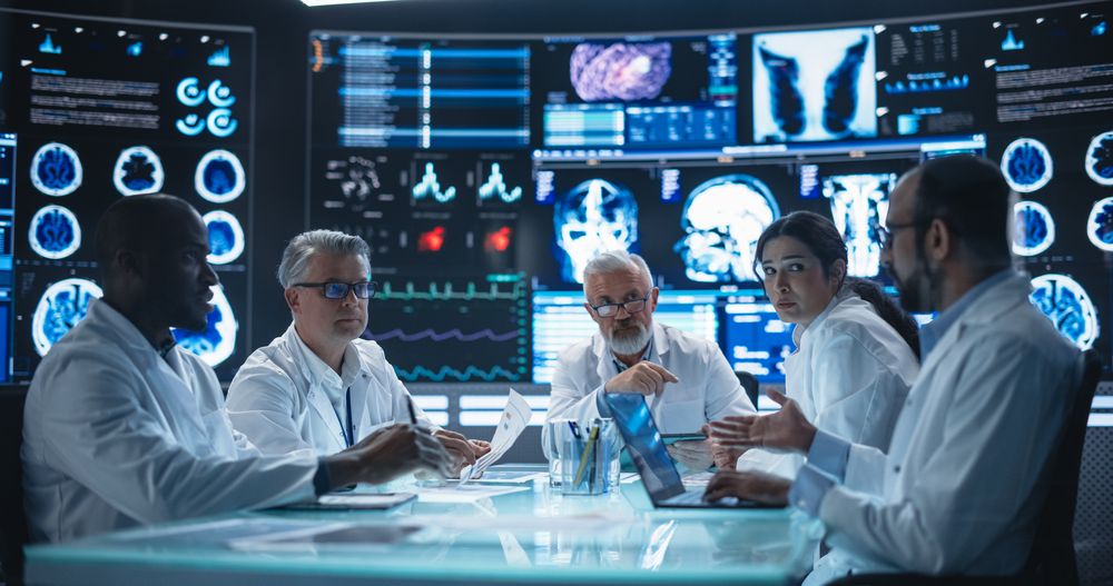 Chief Doctor Conducting a Pre-Operative Assessment Meeting With His Surgical Team.