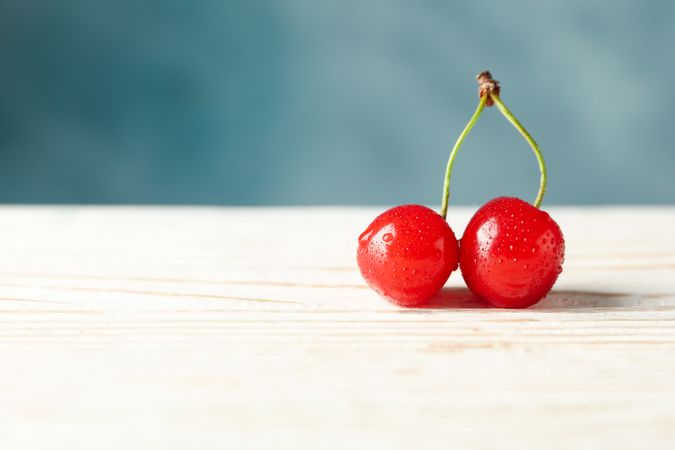 Fresh red cherry on wooden background, close up