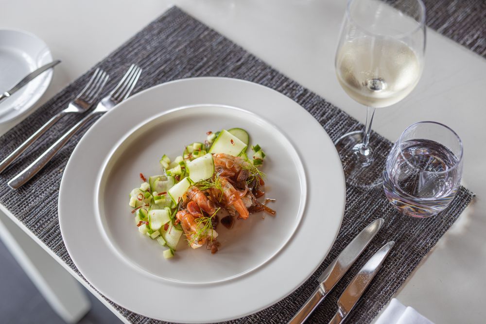 Top view of plated dinner with wine