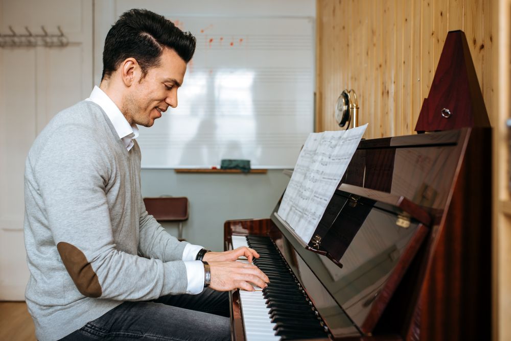 Man playing piano in studio