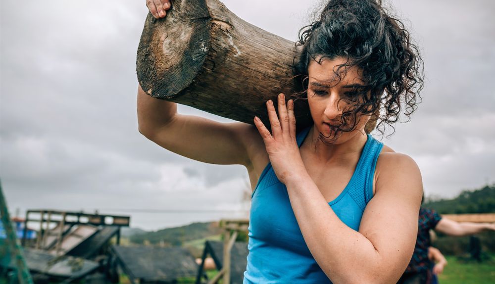 Woman carrying a trunk