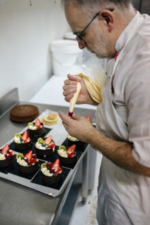 Pastry chef using a pastry bag