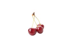 ripe cherry fruits, isolated on light background