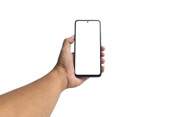 first person perspective of male hand holding smartphone with blank screen smartphone