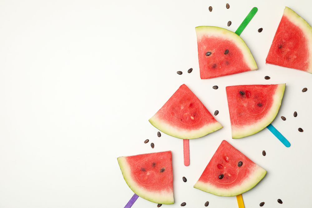 Composition with fresh watermelon slices on blank background, top view